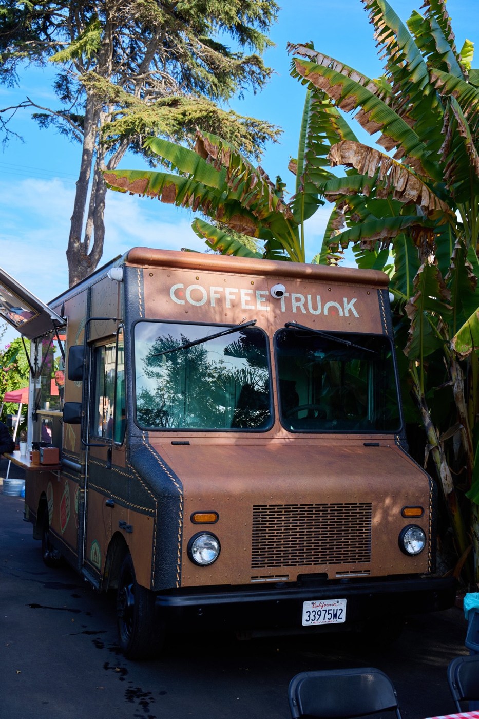 Front view of the small brown Coffee Trunk mobile coffee truck
